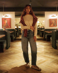Cream_long_sleeve_top_styled_with_jeans_and_sweatshirt