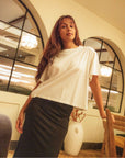 Ecru_cropped_t-shirt_in_organic_cotton_with_black_skirt