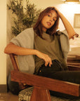 Khaki coloured organic cotton t-shirt with black jeans