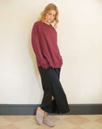 Oversized_black_t-shirt_dress_with_pockets_and_burgundy_sweatshirt