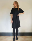 Short_black_t-shirt_dress_with_tights_for_winter