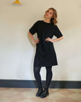 Short_black_t-shirt_dress_with_tights_for_winter