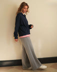 navy sweatshirt and grey joggers