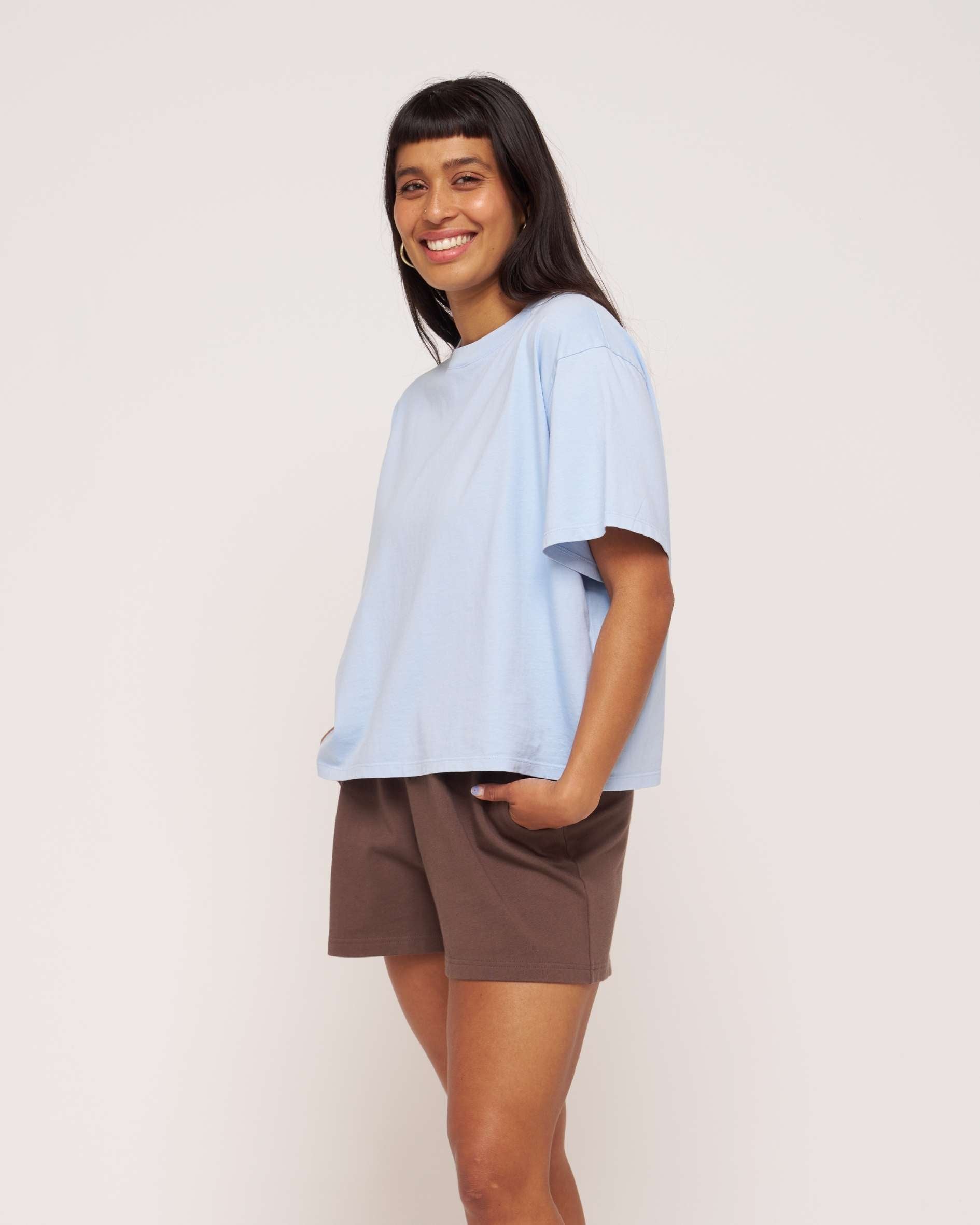 Blue_boxy_organic_cotton_t-shirt_styled_with_brown_shorts