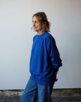 Crew_neck_blue_sweatshirt_with_dropped_shoulders