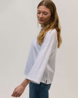 Fully_bound_side_splits_in_white_organic_cotton_top