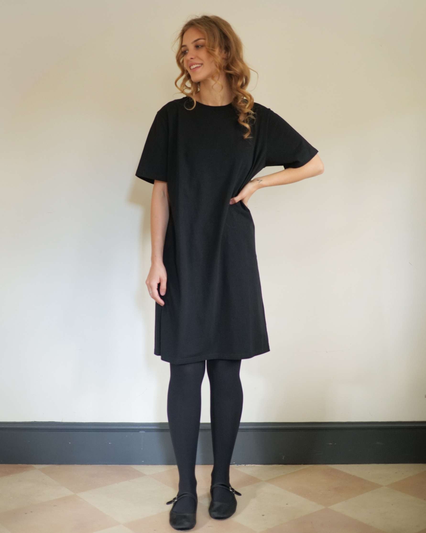 Short_black_t-shirt_dress_with_tights_for_winter