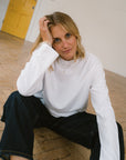 crew_neck_shorter_length_white_t-shirt_with_long_sleeves