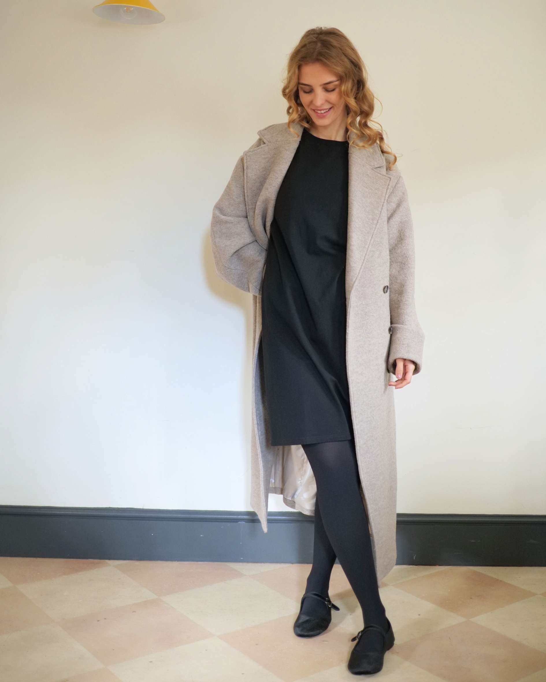 Short_black_t-shirt_dress_with_tights_for_winter